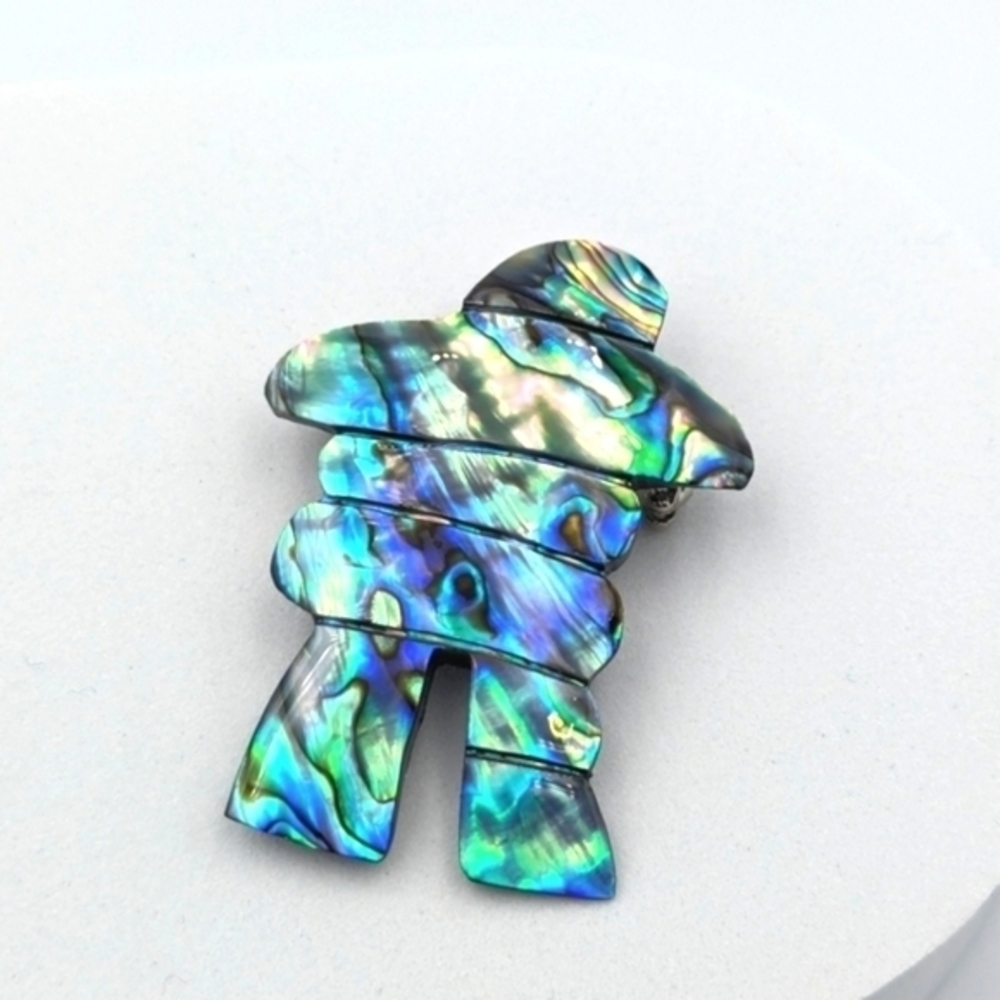 Inukshuk pin brooch carved from abalone shell